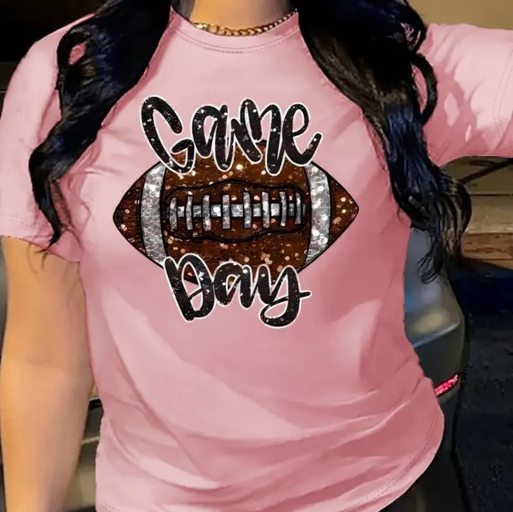 T. Shirt with the logo game day and football earrings.